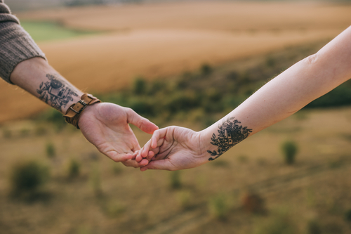 Couples hands with identical tattoos