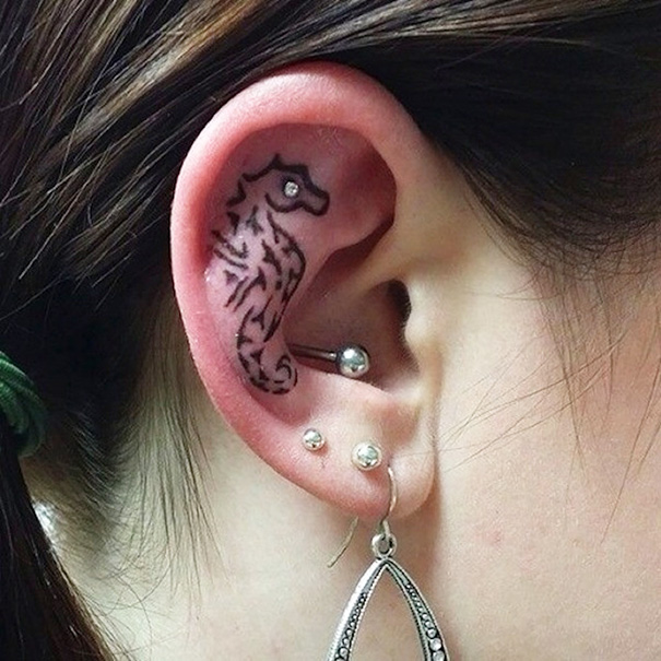 Tattoo design on ear cartilage