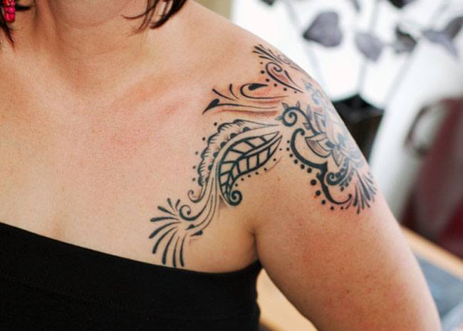 Tattoo design on outer shoulder